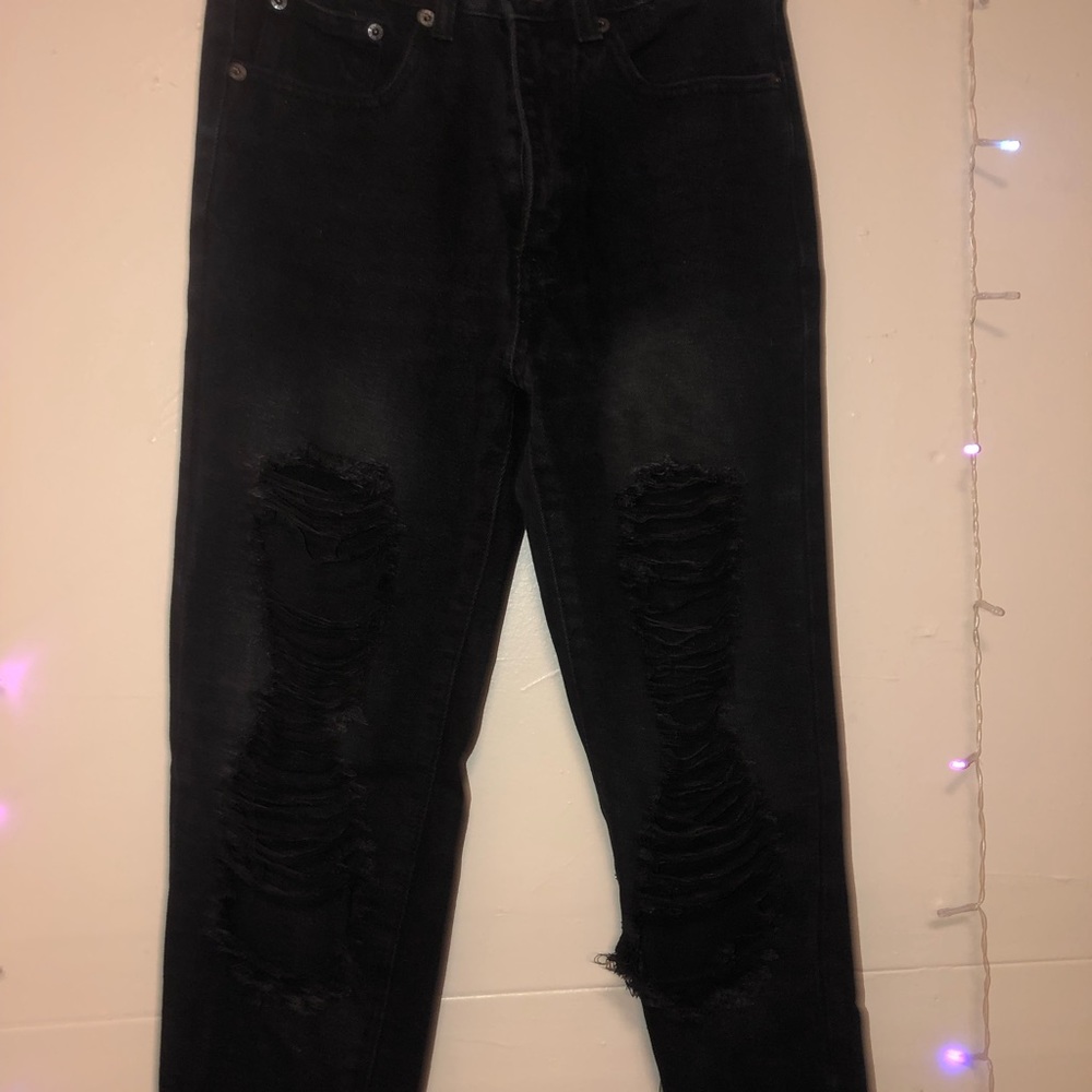 black ripped straight legged jeans